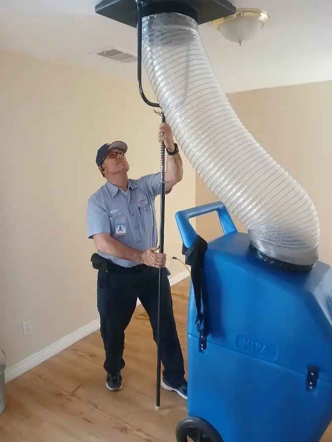 Furnace Tune-Up technician using HEPA equipment in Glendale